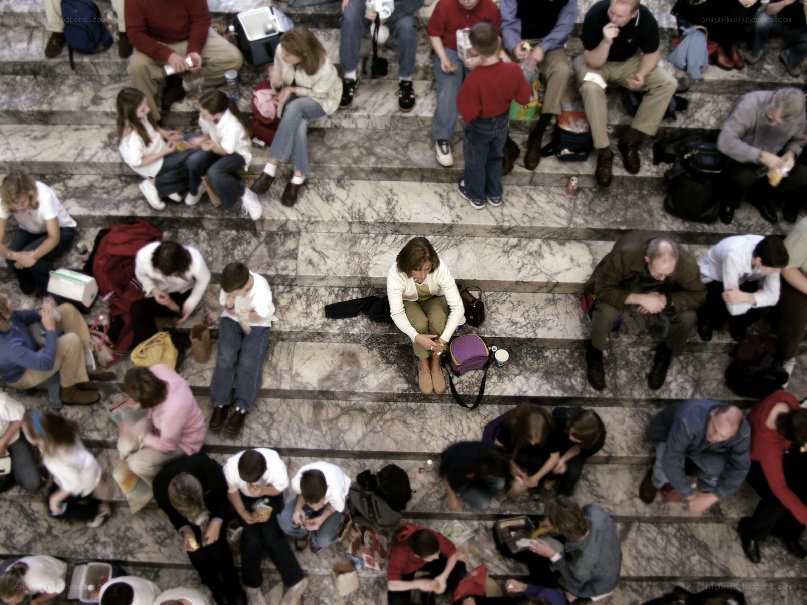 People eating on marble steps