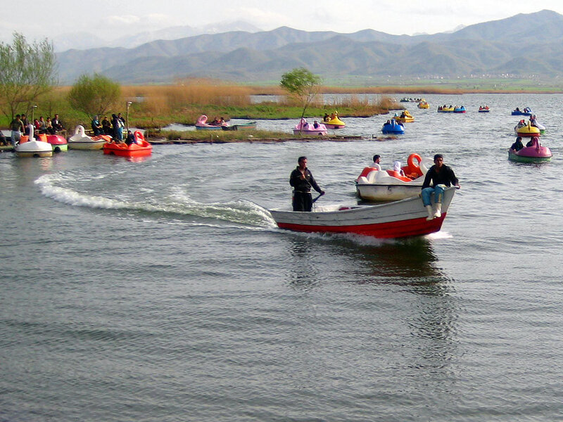 People enjoying boats on a lake