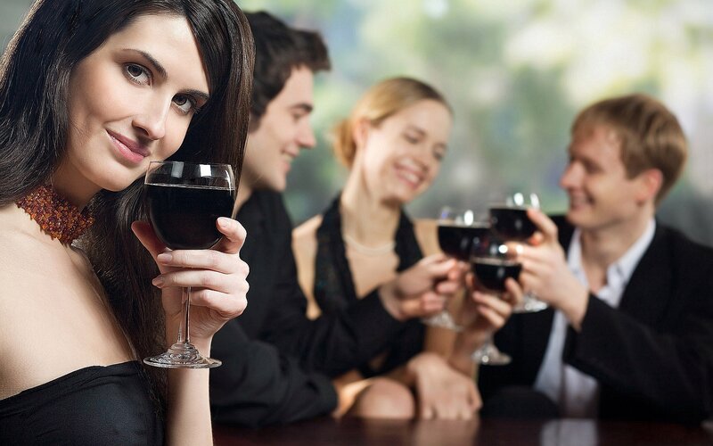 People enjoying wine at a party
