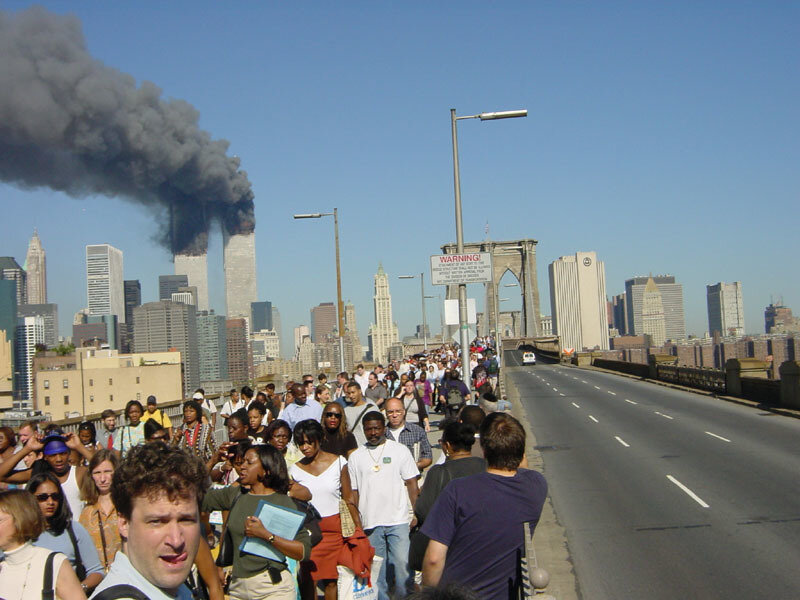 People Evacuating Bridge