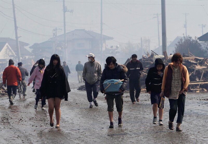 People Evacuating Debris