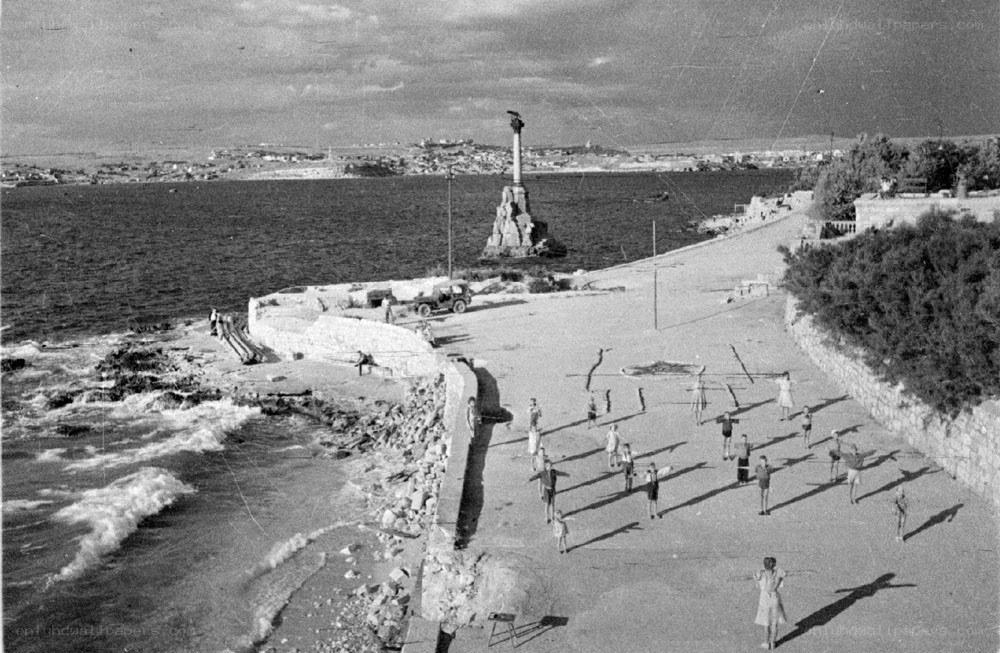 People exercising by the sea