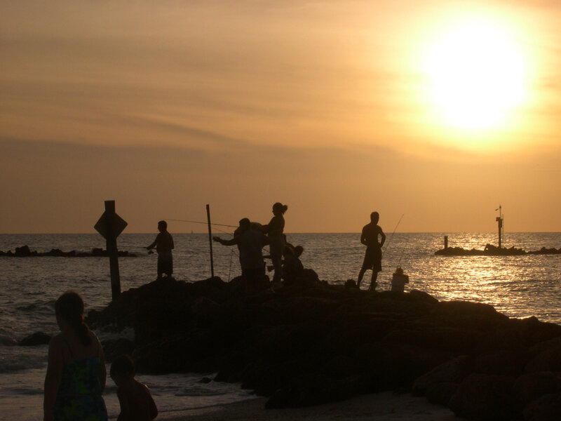 People Fishing at Sunset