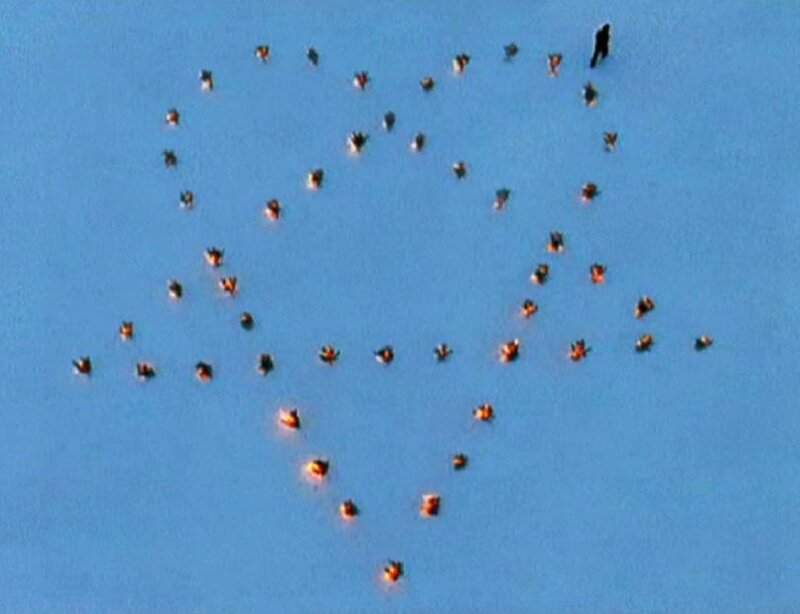 People forming a heart shape