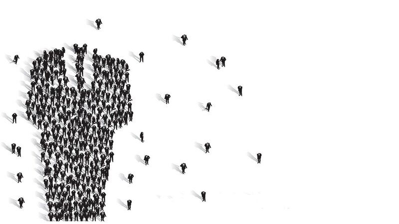 people forming a lightbulb shape