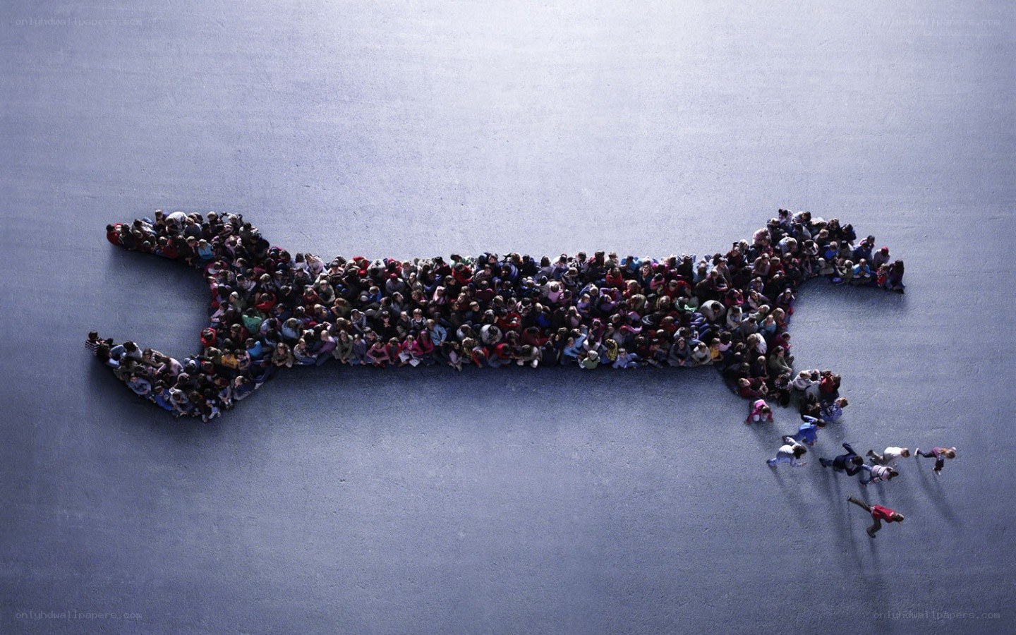 People forming a wrench shape