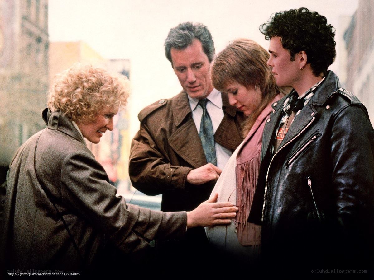People gathered around a pregnant woman