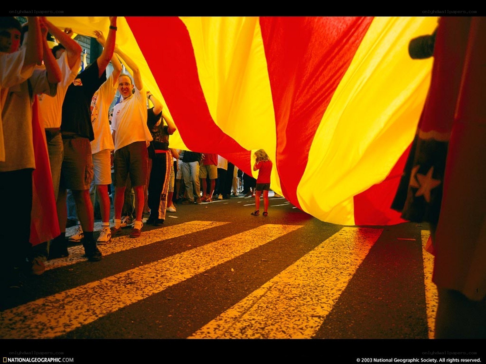 People holding a large flag