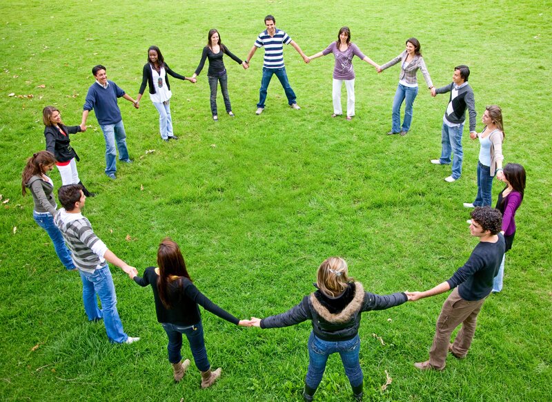 People holding hands in a circle