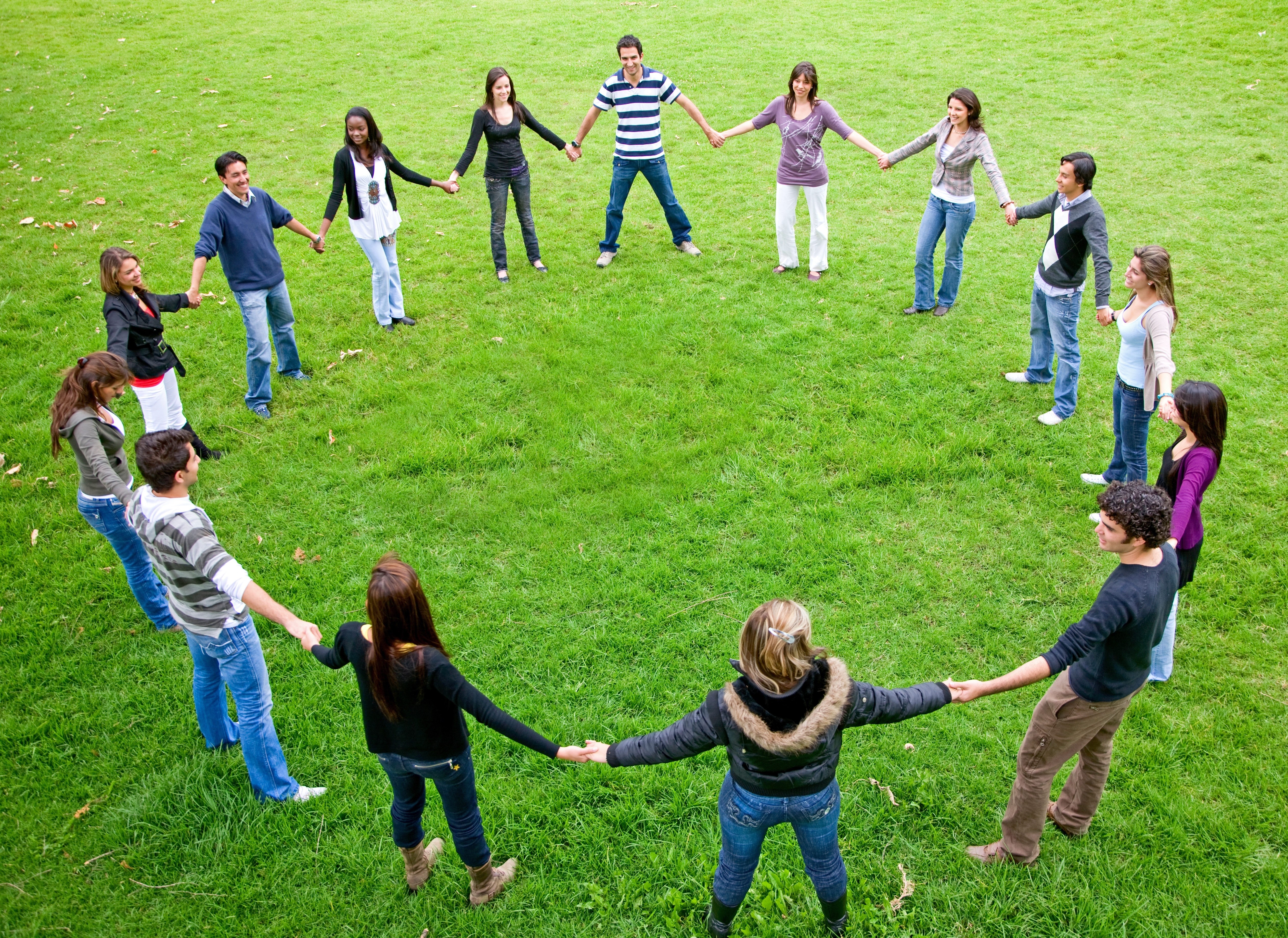People holding hands in a circle