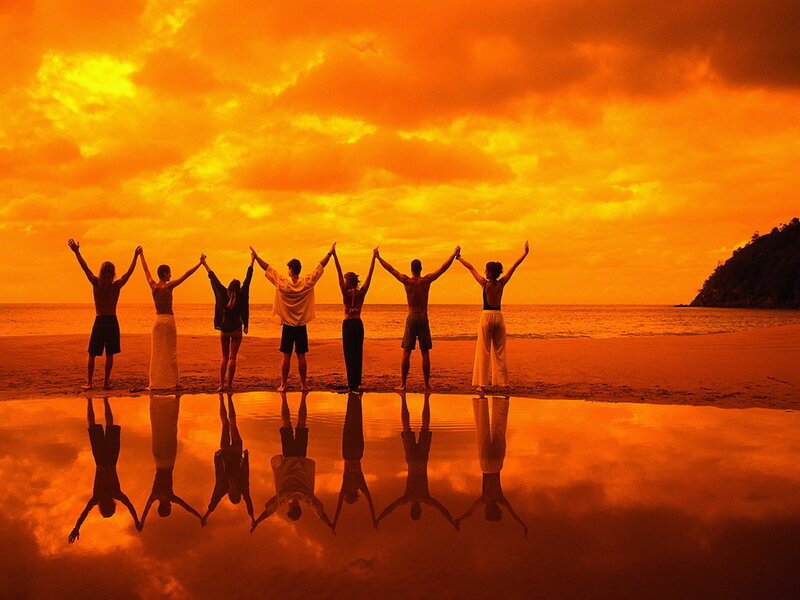 People Holding Hands on Beach