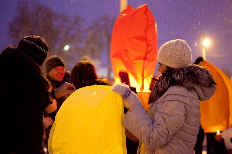 People Holding Lanterns