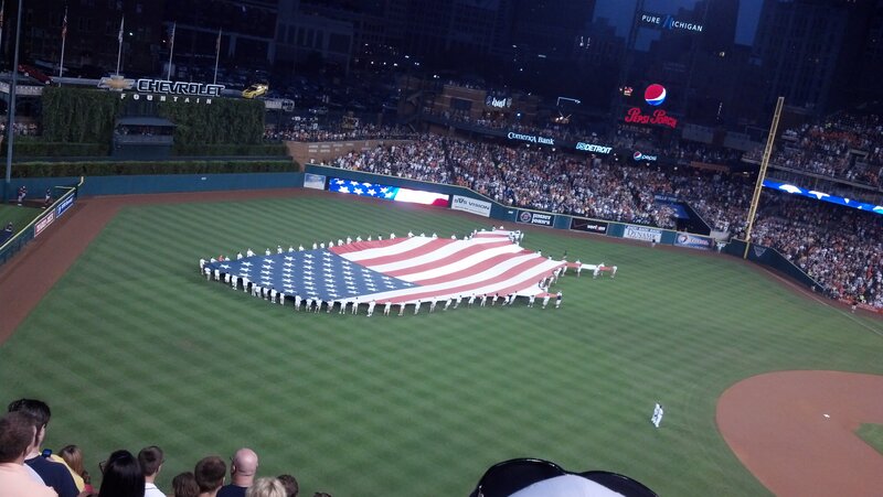 People Holding Large Flag