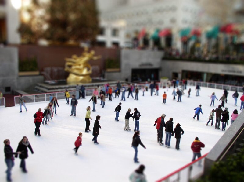 People ice skating at a rink