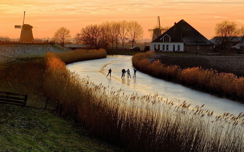 People Ice Skating — Orange, Serene