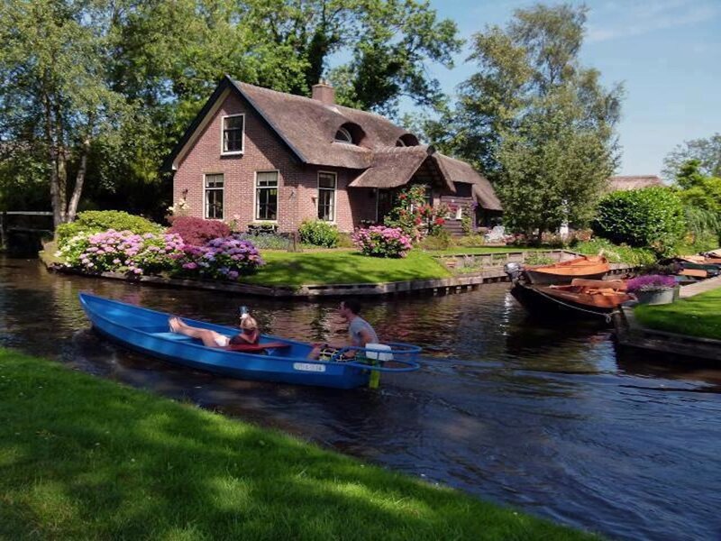 People in a Blue Boat