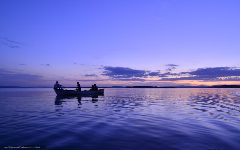 People in a boat at dusk