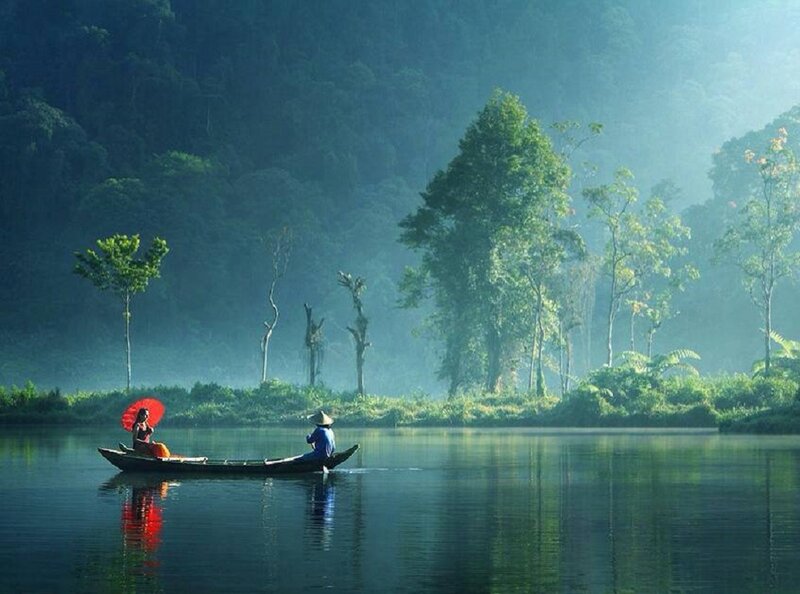 People in a Boat — Green, Serene, Morning, Photograph, Umbrella