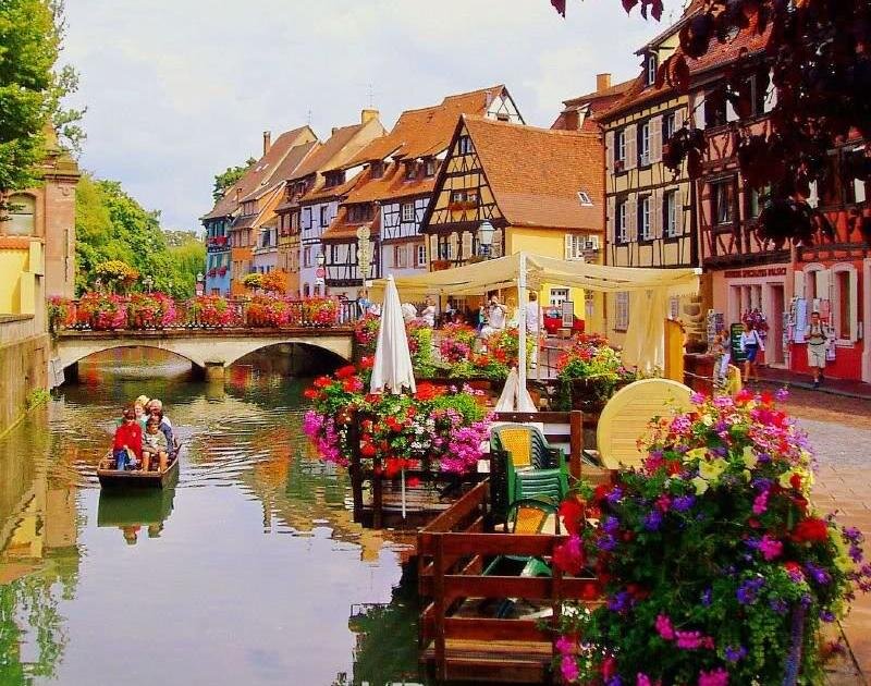 People in a Boat on a Canal