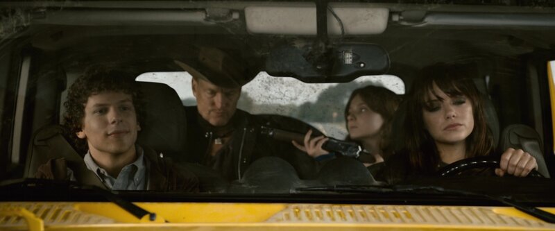 People in a car with a gun