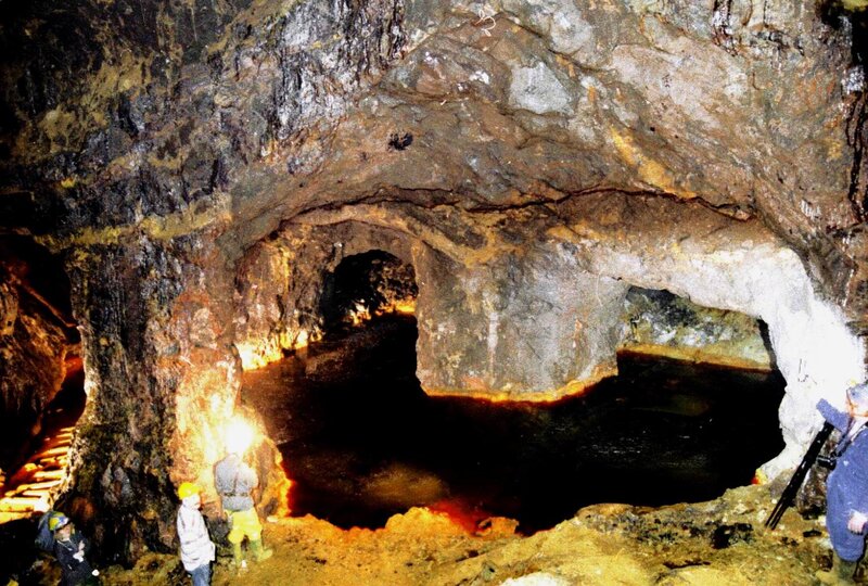 People in a Cave — Brown, Dark