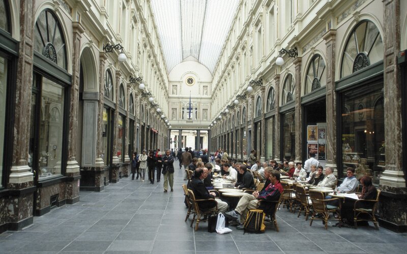 People in a covered shopping arcade