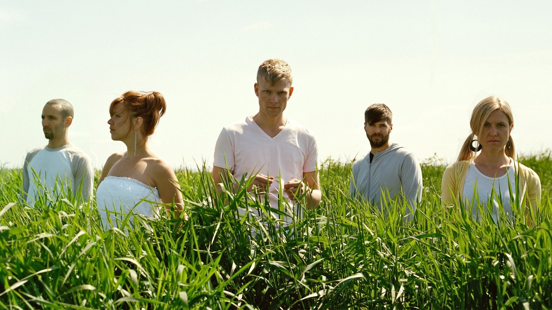people in a field of tall grass