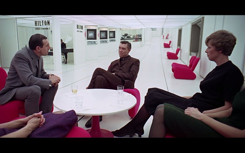 People in a futuristic lounge