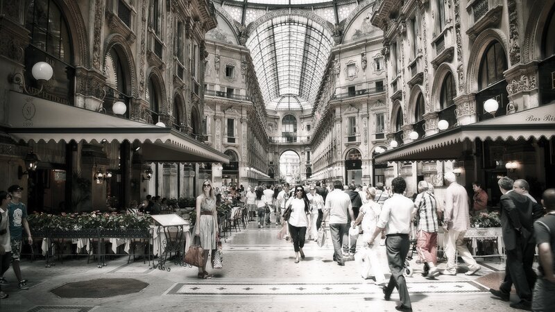People in a grand shopping arcade