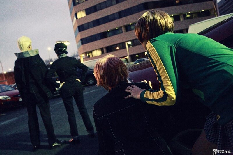 people in a parking lot at dusk
