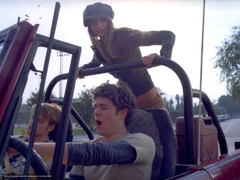 People in a red jeep