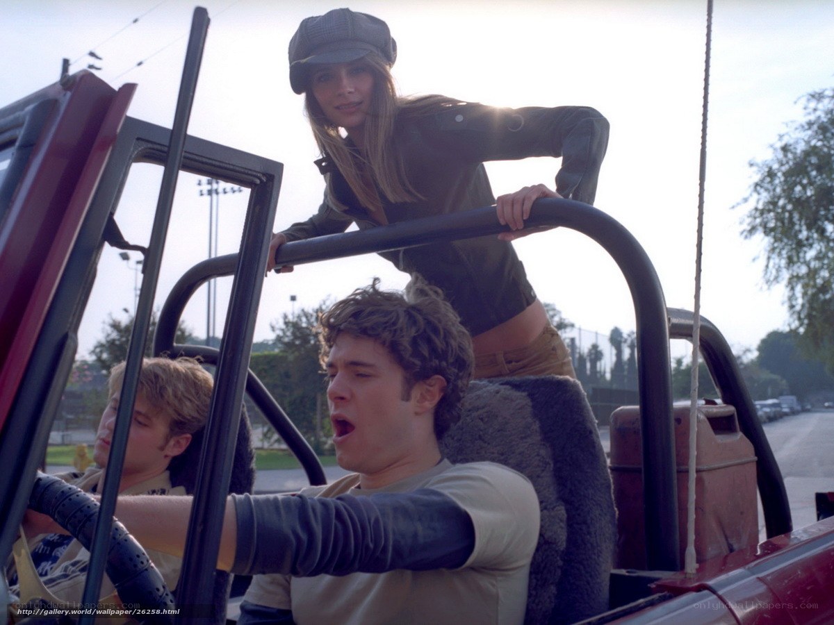 People in a red jeep