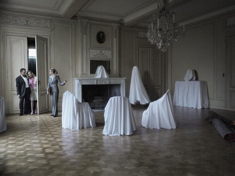 People in a Room with Ghost Figures