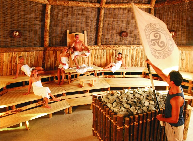 People in a sauna with flag