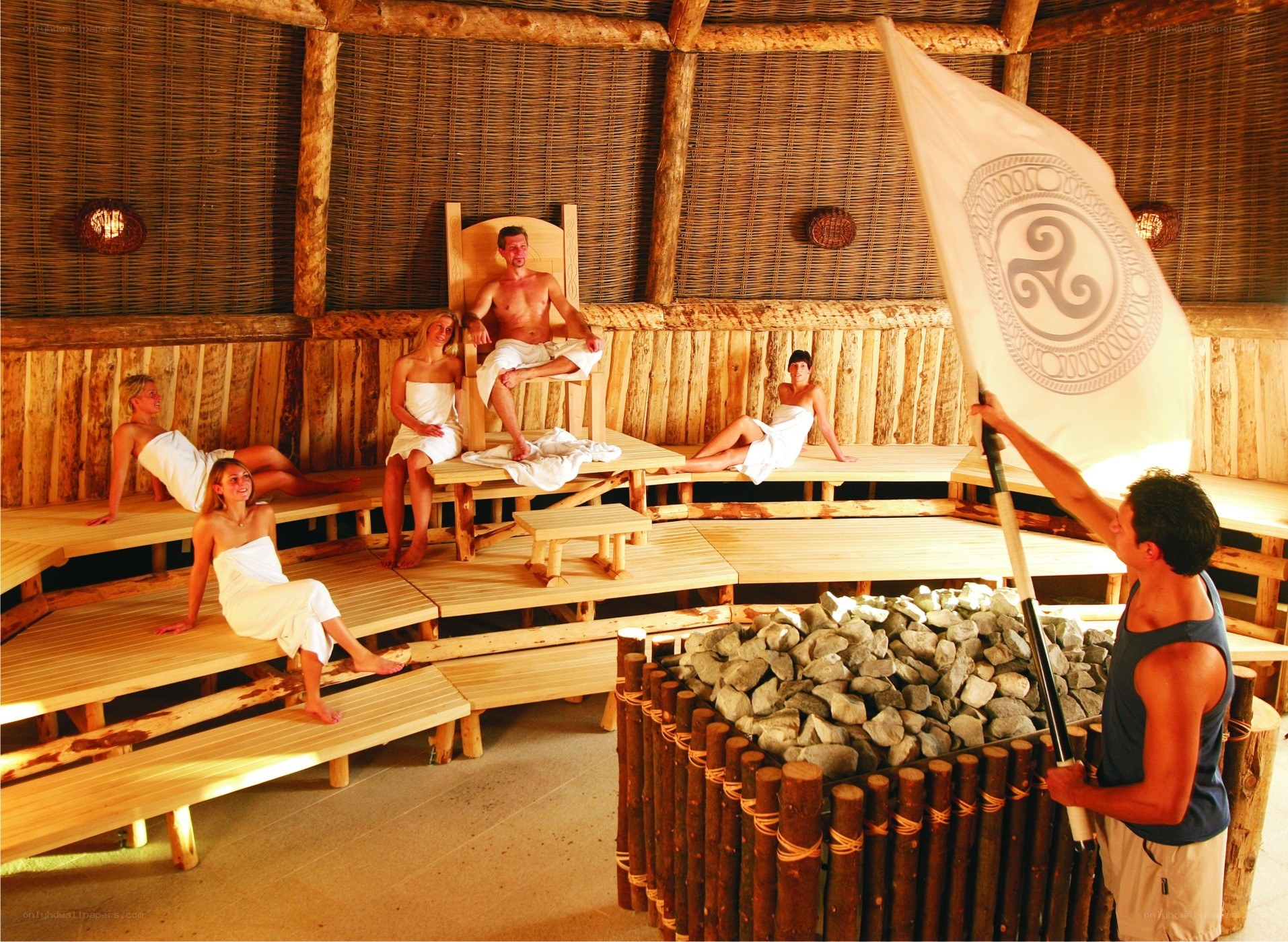 People in a sauna with flag