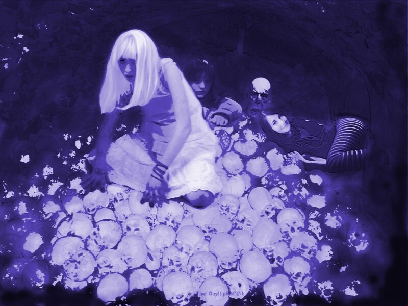 people in a skull-filled tunnel