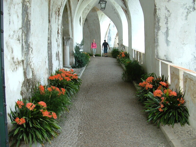 People in Arched Corridor