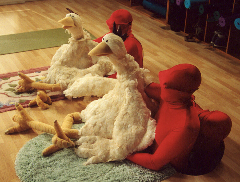 People in bird costumes on floor