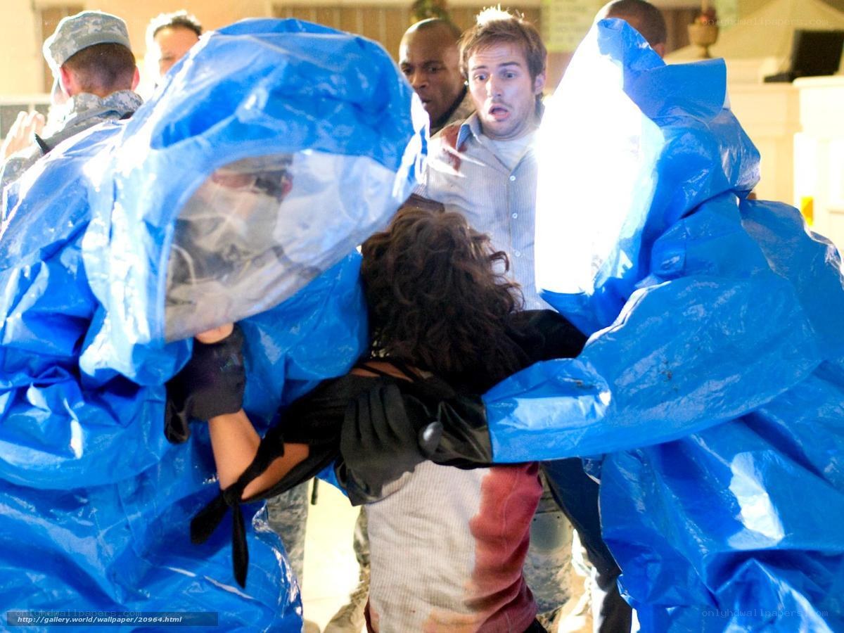 People in blue protective suits