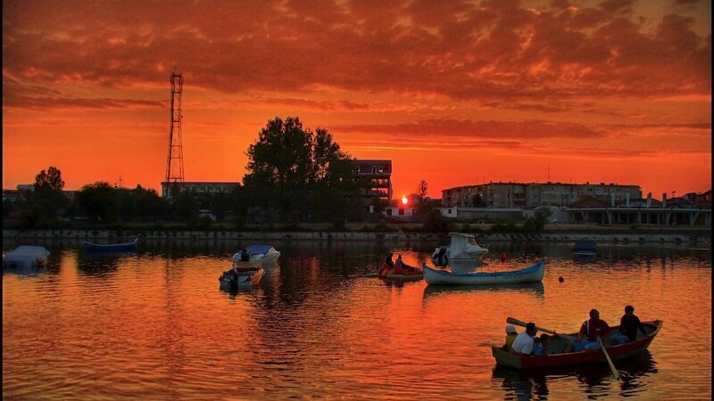 People in Boats at Sunset