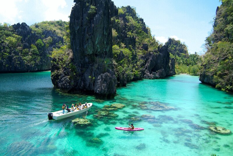 People in Boats on Turquoise Water