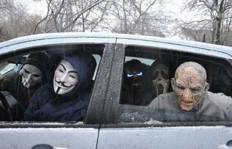 People in Car with Masks