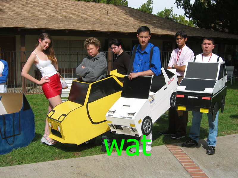People in cardboard car costumes
