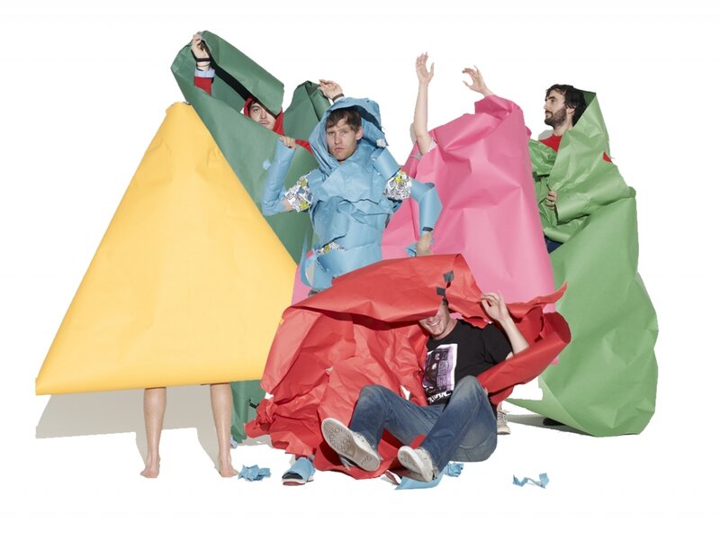 people in colorful paper costumes