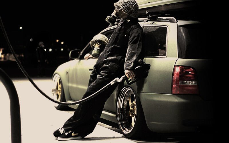 people in gas masks at night
