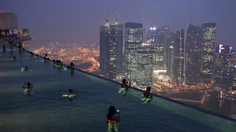 People in Infinity Pool — Blue, Dramatic