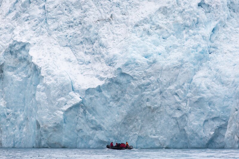 People in Inflatable Boat — Blue, Dramatic