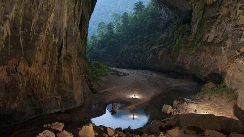 People in Large Cave — Brown