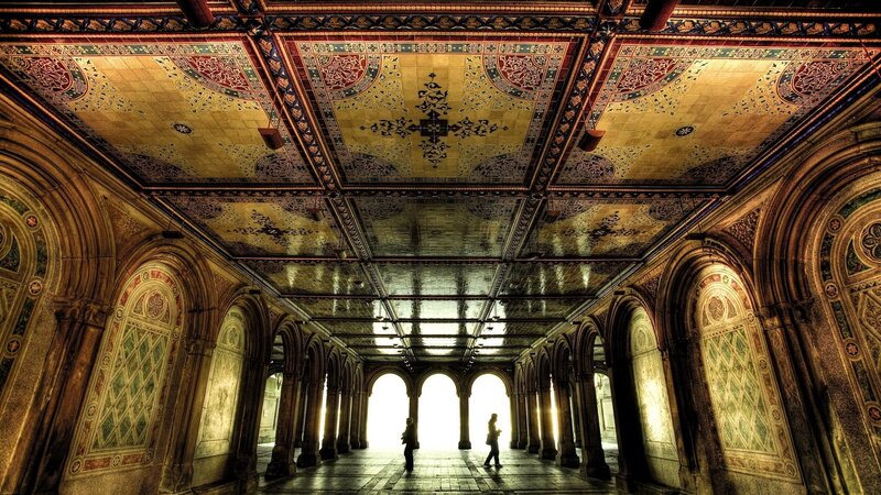 People in Ornate Hallway — Gold