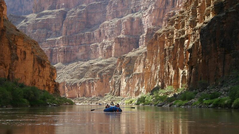 People in Raft on River — Brown, Serene, Afternoon